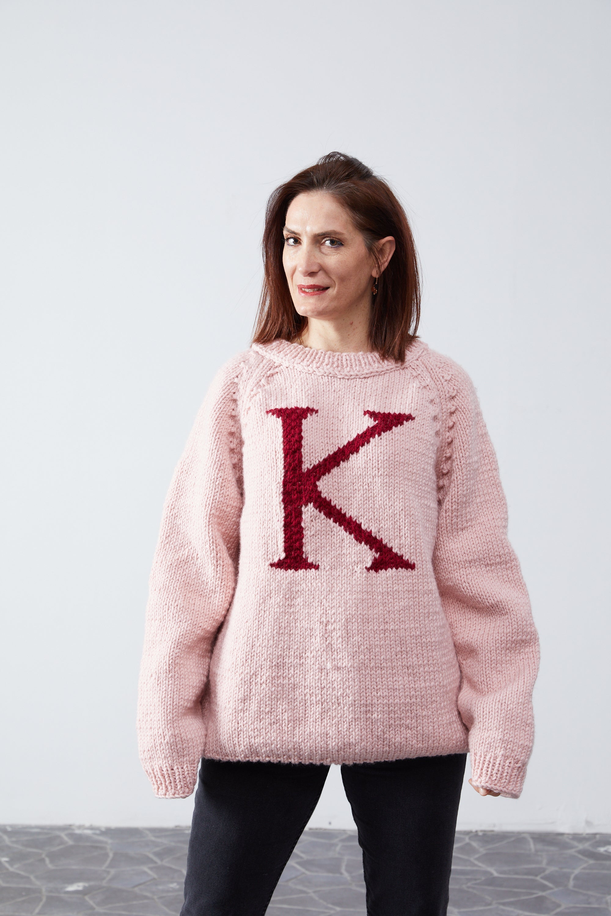 Pink Monogram Weasley jumper with red K letter — hand-knit wool