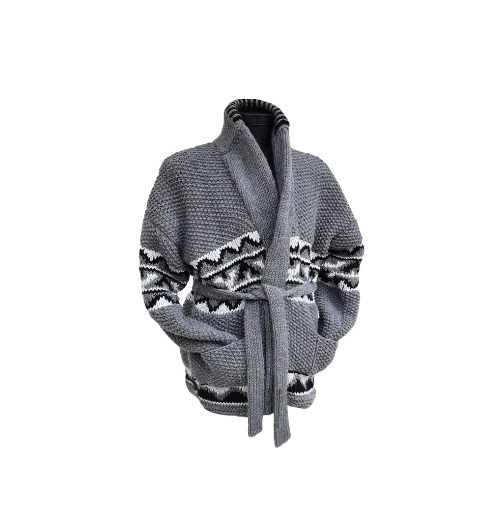 Grey chunky knit cardigan with black and white geometric pattern, shawl collar and tie belt