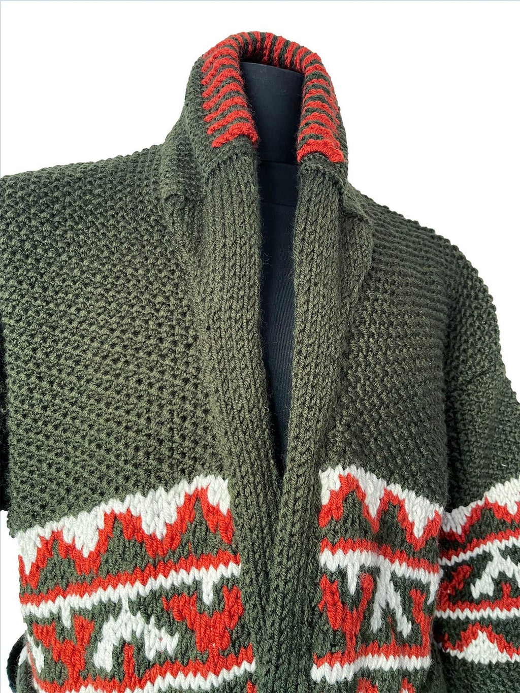 Green cardigan red and white patterned trim around collar
