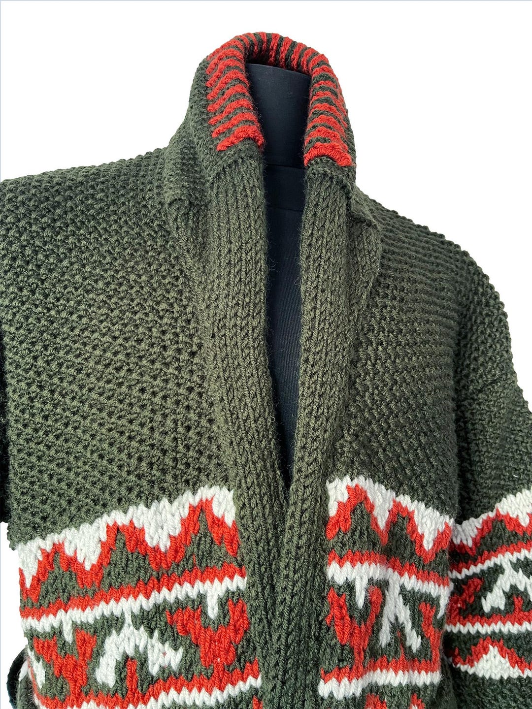 Green cardigan red and white patterned trim around collar