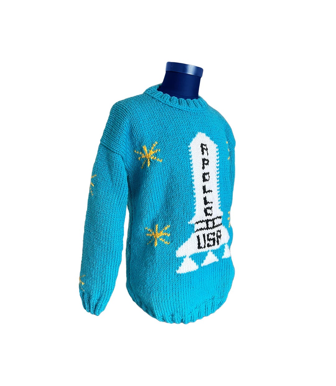 Apollo sweater detail with yellow star accents