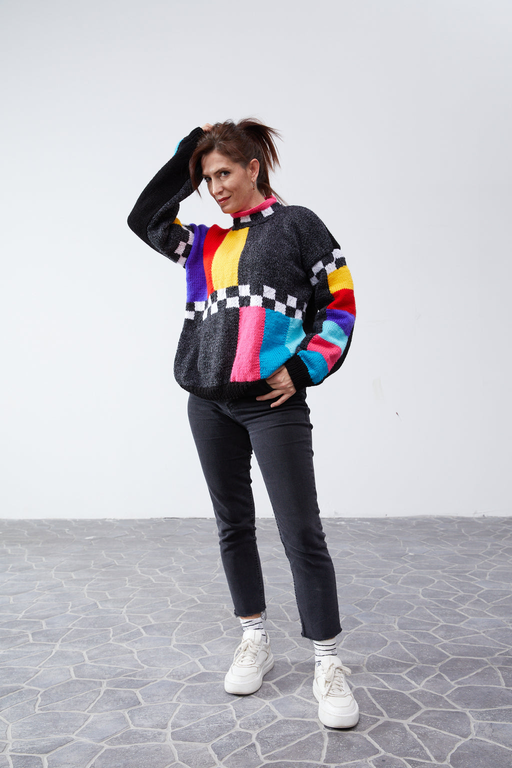 Retro test-pattern colorblock sweater with checkerboard trim, relaxed unisex fit